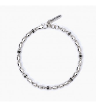 Pulsera de plata 925 rodiada, cadena cilíndrica de 4 mm e inserciones con circonitas negras de 1,
50 mm, longitud regulable de 18,5 a 21 cm.